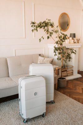 white luggage near the couch